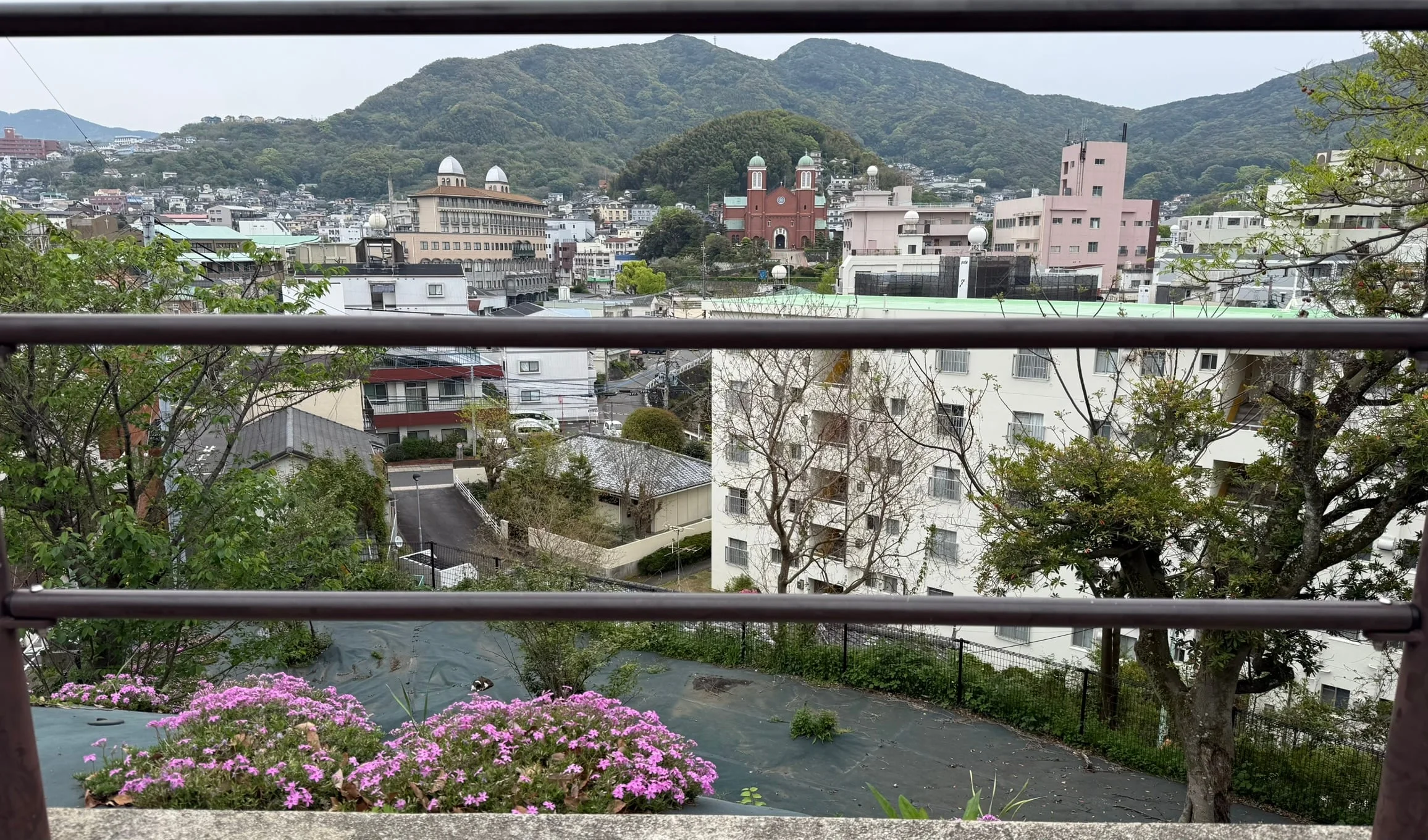 Flower planters along a canal bridge in Nagasaki